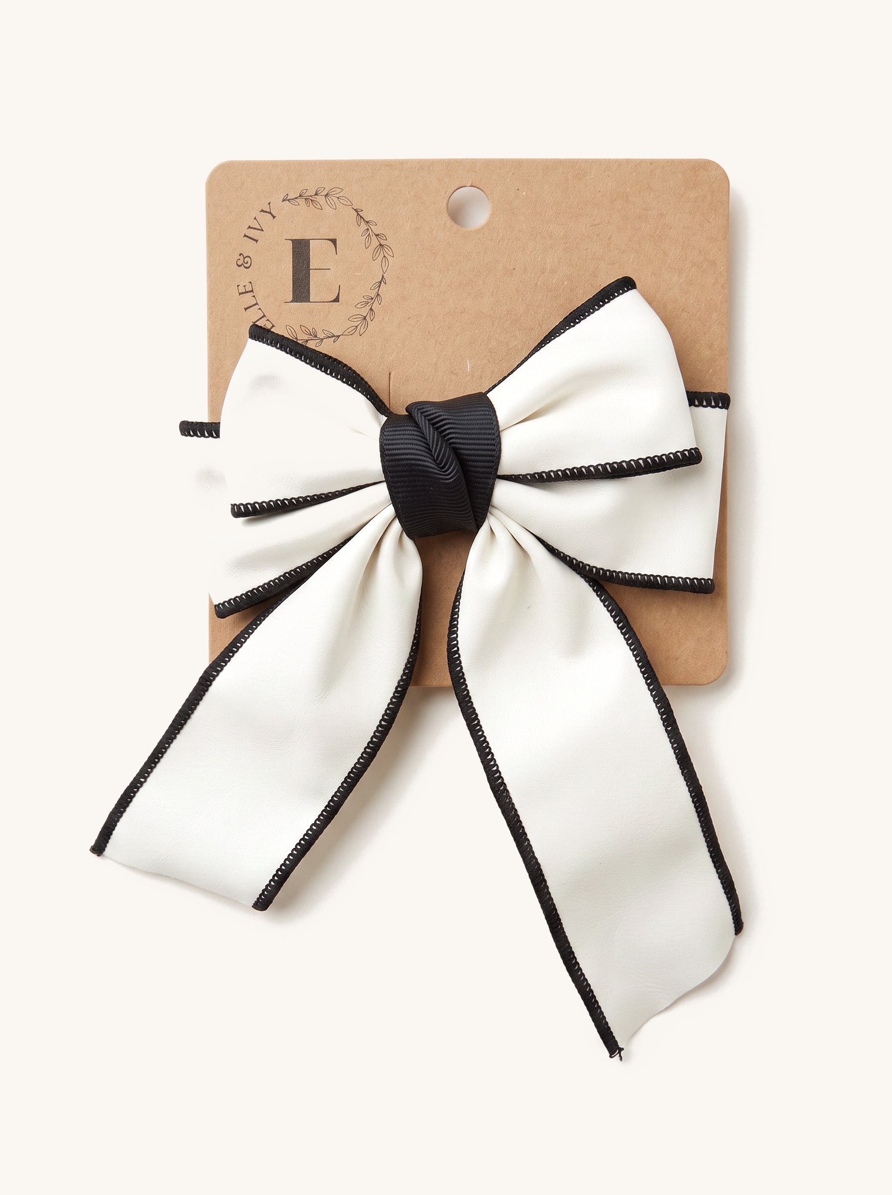 Ivory Noir-Trim Leather Sailor Bow — on the Elle & Ivy packaging card